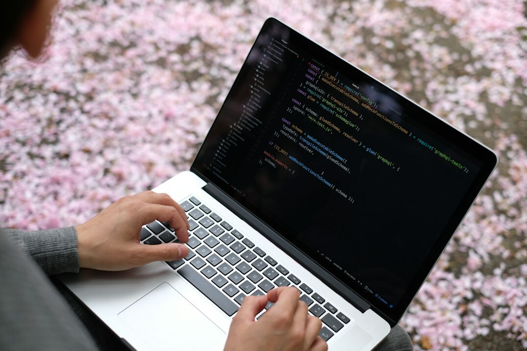 person learning to code on laptop