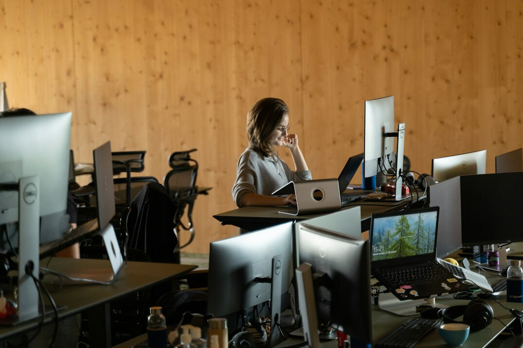 woman coding at desk
